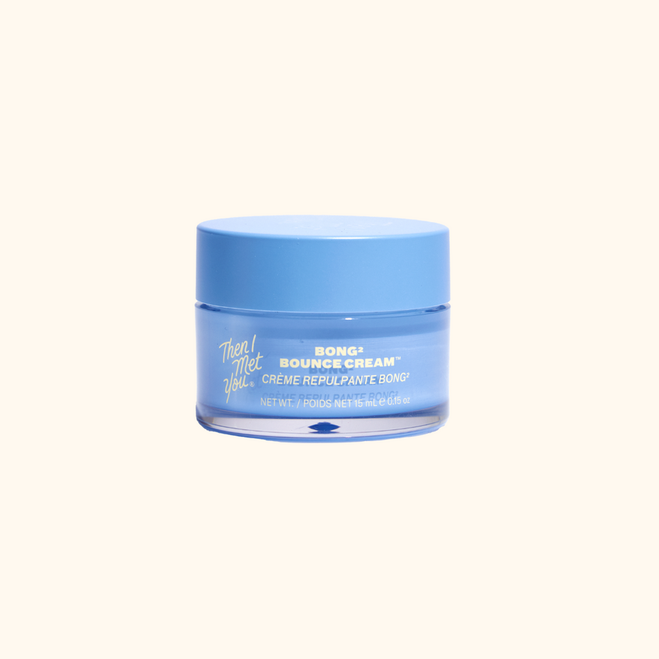 Small blue jar of Bong² Bounce™ Cream with light blue lid on neutral background.