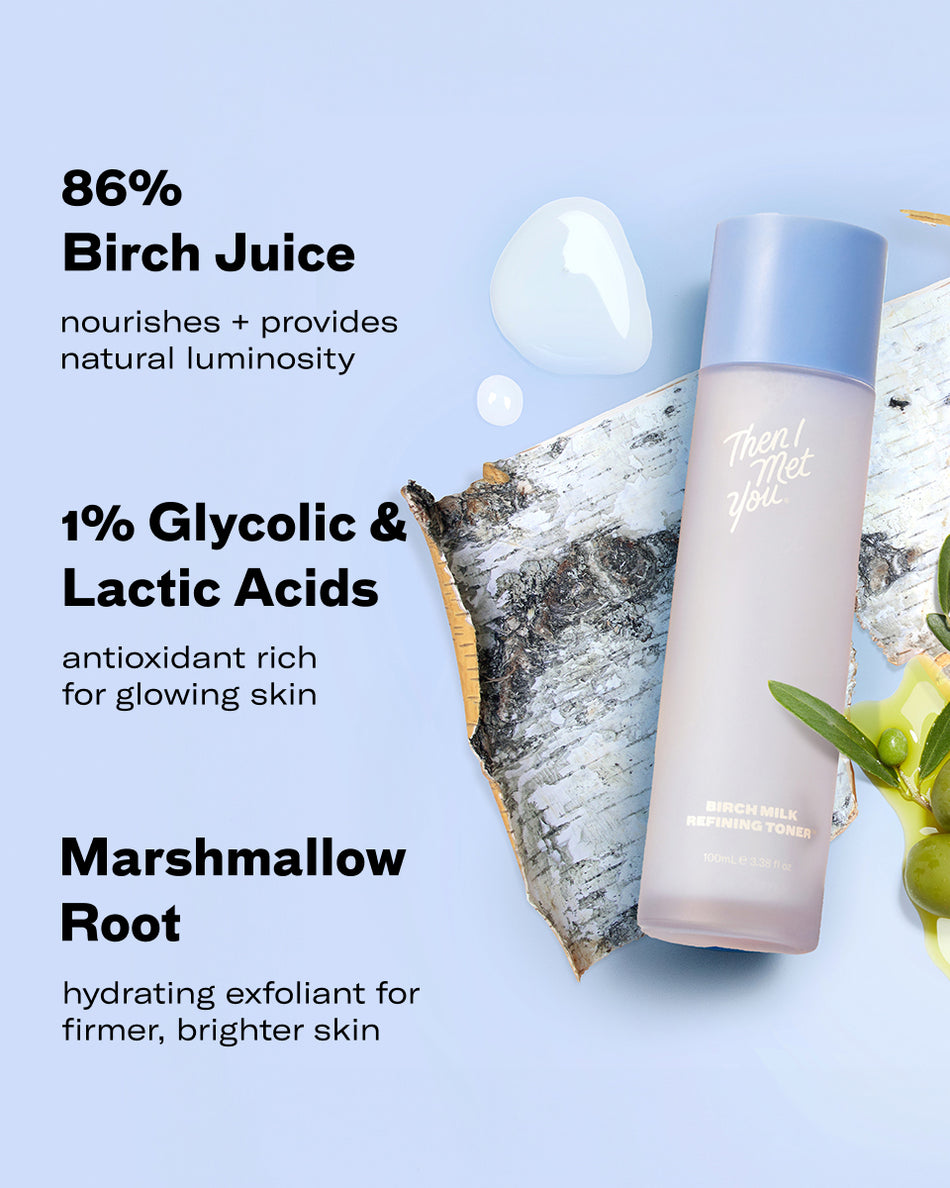 Birch Milk Refining Toner bottle with blueberry and green leaves on light background.