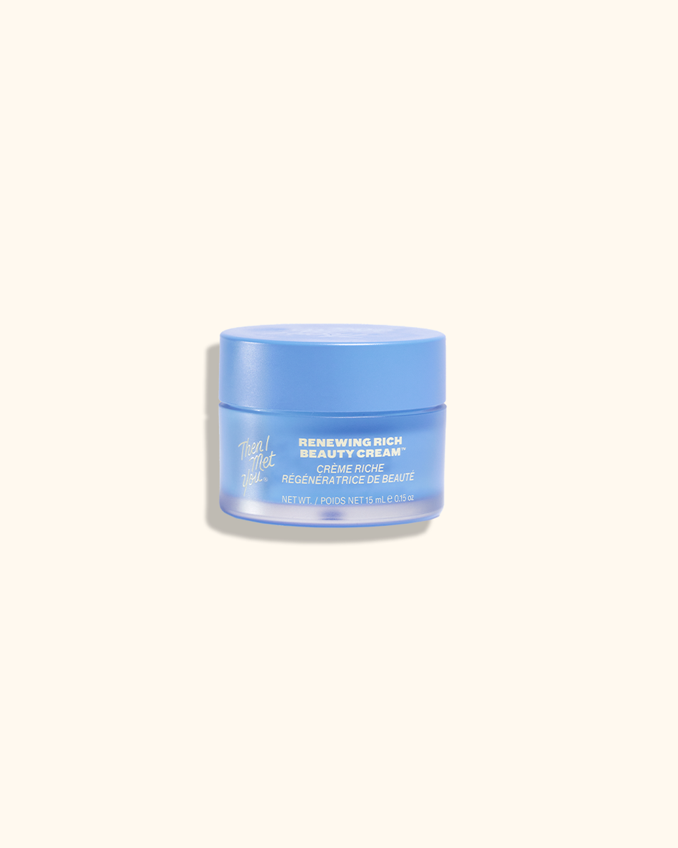 Blue jar of Renewing Rich Beauty Cream with white and silver text and floral design on label.