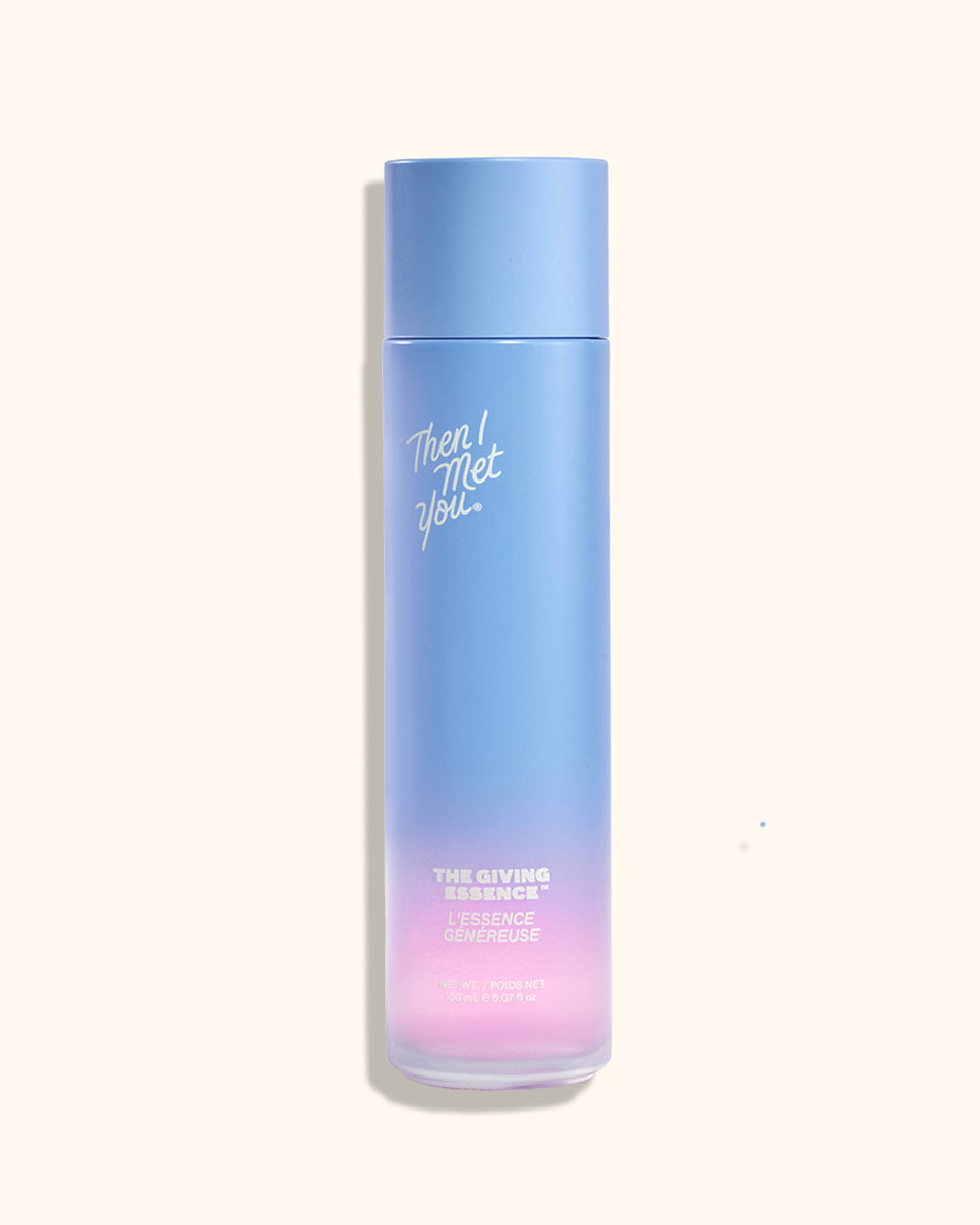 Tall cylindrical bottle with gradient blue to pink color and white text on front.