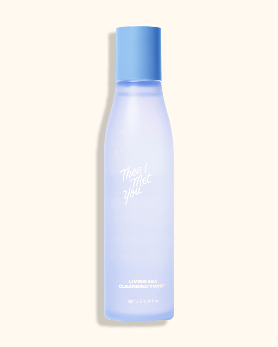 Tall frosted blue bottle of Living Sea Cleansing Tonic with a solid blue cap and white text.