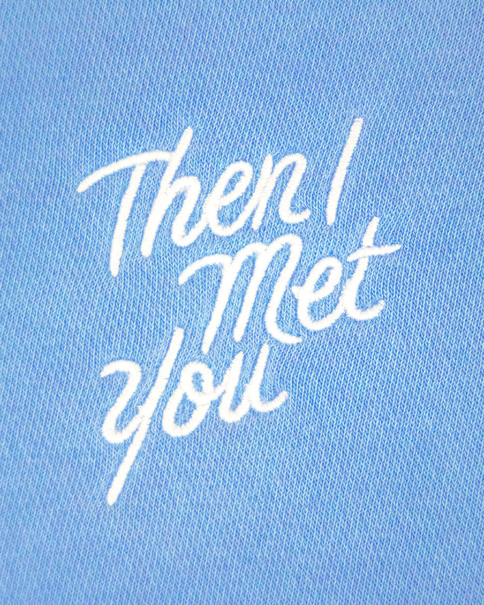 Periwinkle blue pullover with white cursive "Then I Met You" text on front.